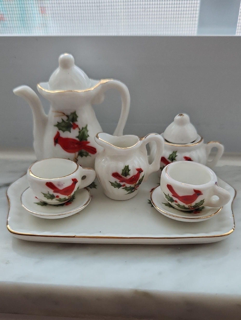 Vintage Lefton miniature ceramic tea set featuring a red cardinal bird